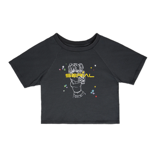 Black crop top with 'SERIAL' text and a graphic of a character pointing a gun, surrounded by colorful star designs