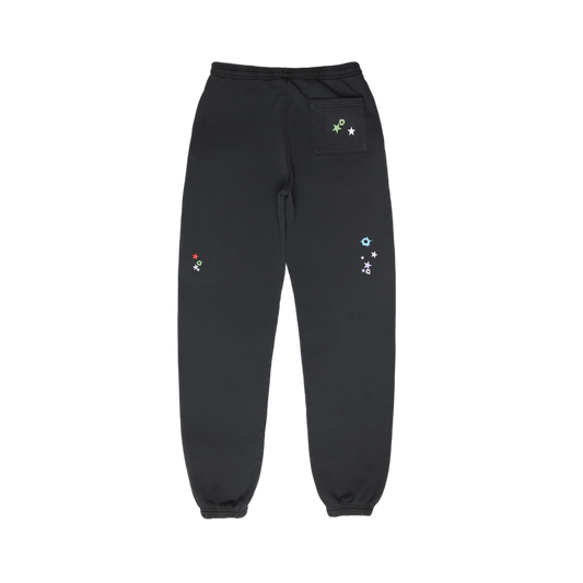 Black sweatpants with colorful star designs and a back pocket