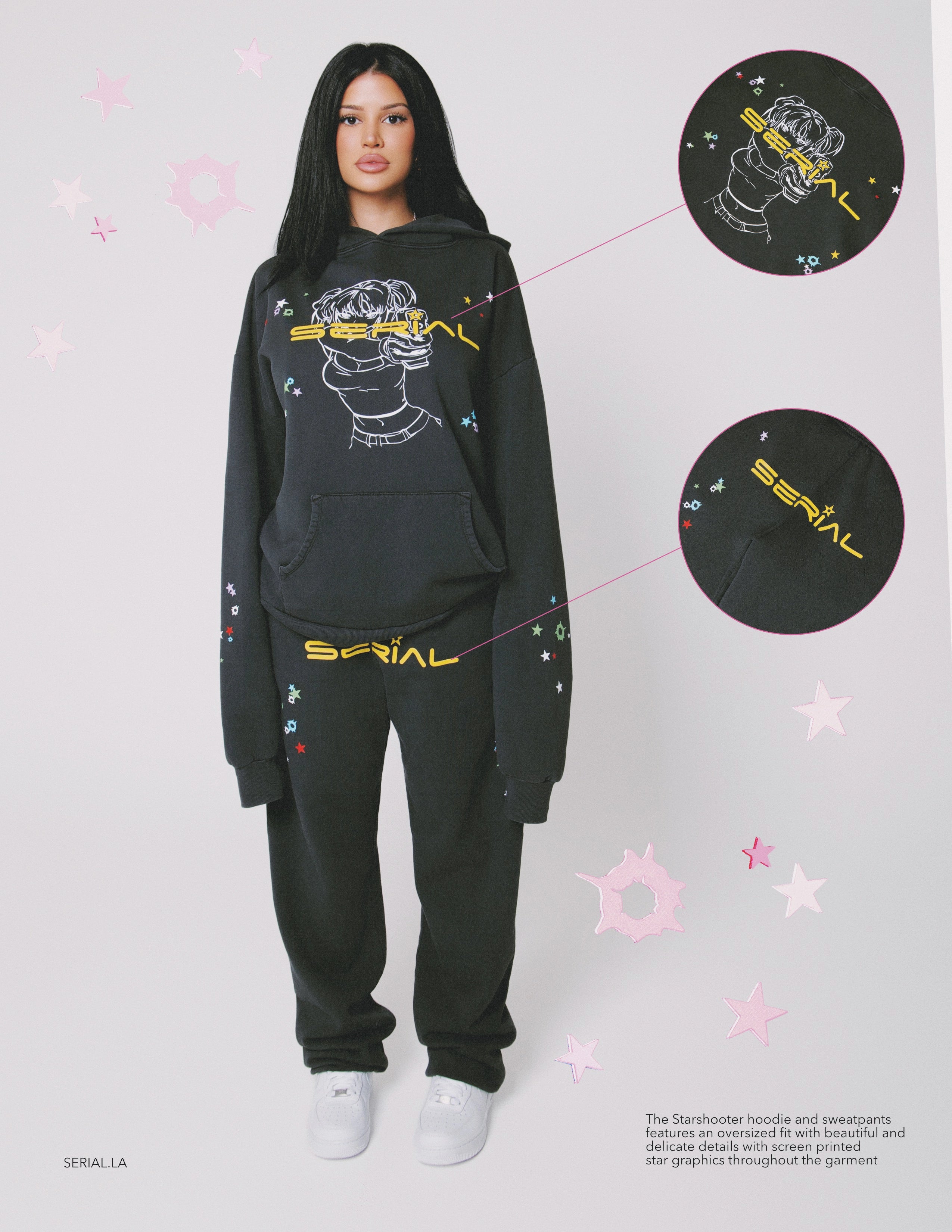 Model wearing black 'SERIAL' hoodie and sweatpants with colorful star designs, close-up highlighting graphic details