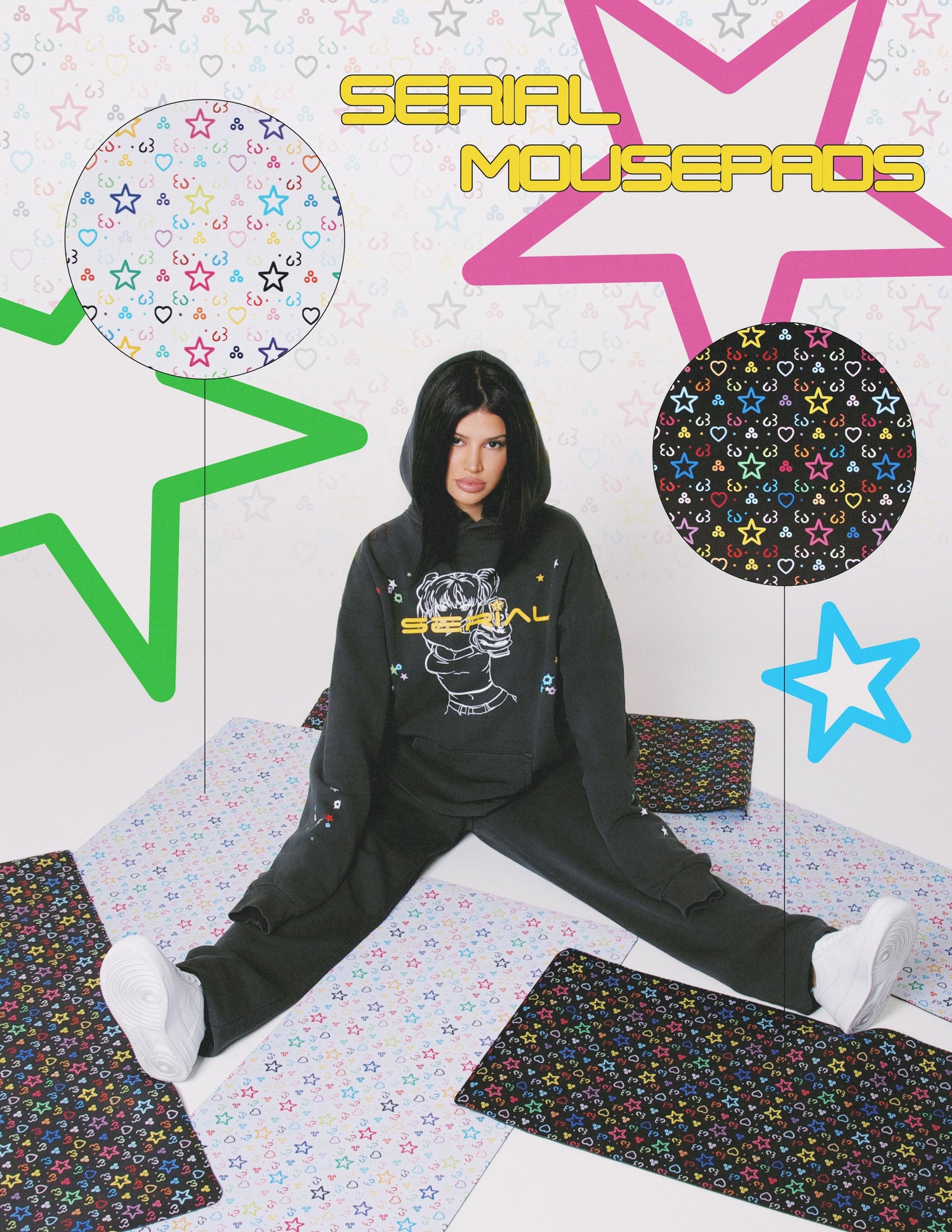 Model in a 'SERIAL' hoodie sitting on the floor surrounded by colorful star-patterned mousepads, with text highlighting 'SERIAL Mousepads